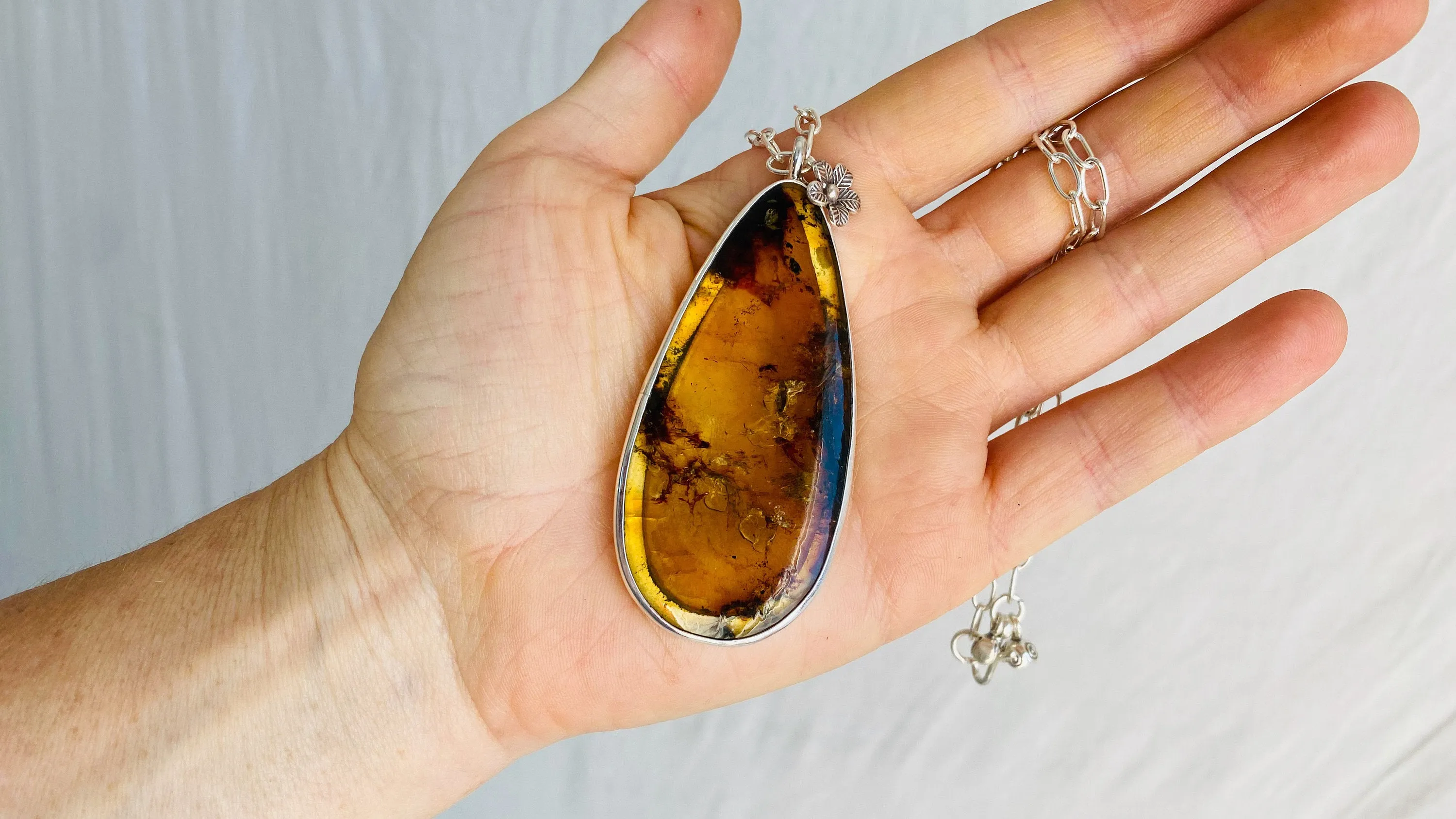 Large Amber Pendant on a Silver Chain. 1211